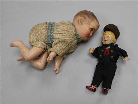 A 1930s automaton doll and another